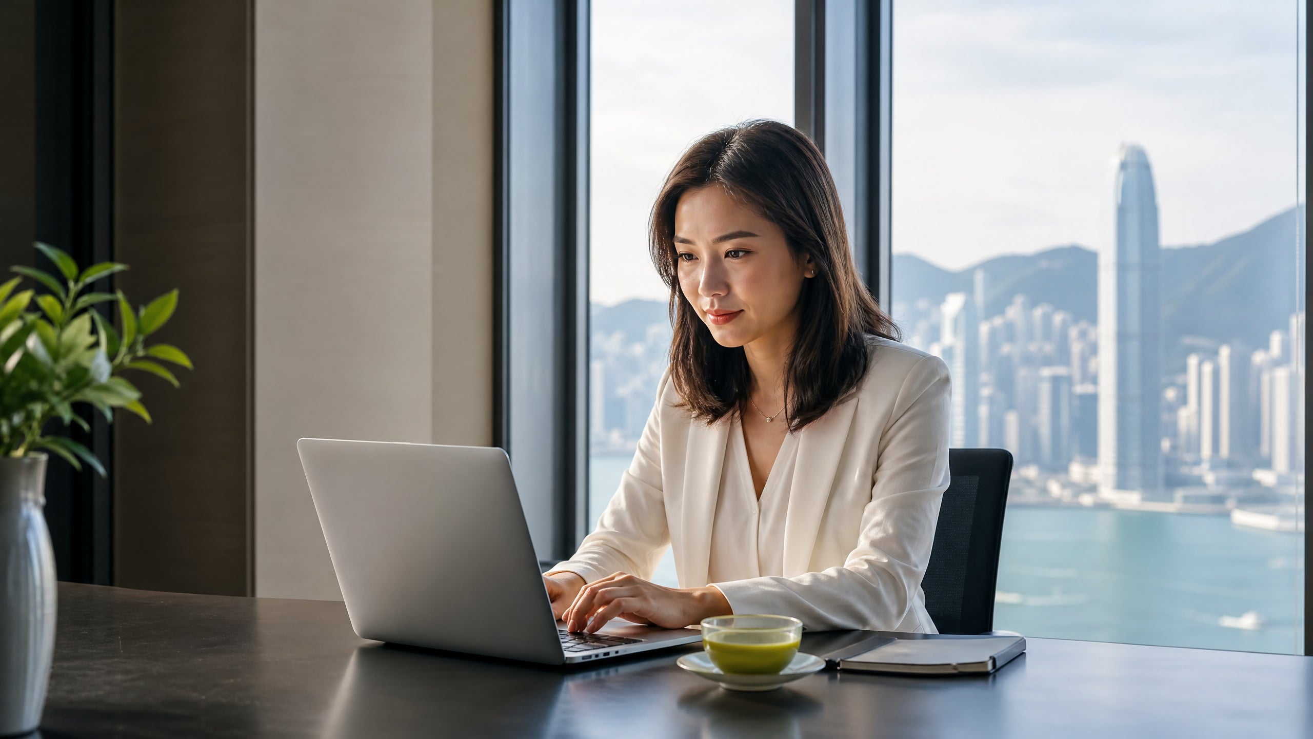 Asian professional working beside Hong Kong harbour — daily focus, energy and nerve health lifestyle